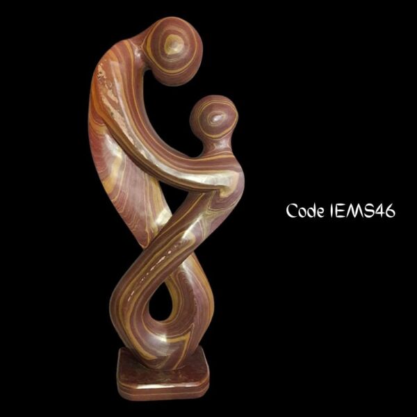 modern abstract sculpture is of a couple in romance in Teak Brown Marble