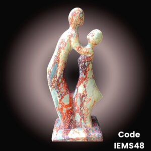 Modern abstract marble sculpture is of a couple in romance is in onyx Marble